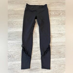 Cute ALO Yoga Black Leggings with cutouts on legs.